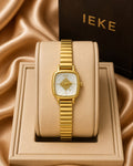 Ieke in gold and white