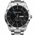 Men's Silver-Tone Quartz Watch – Black Dial & Day-Date. Black dial with concentric detailing, matching metal bracelet, quartz marking, and day-and-date window.