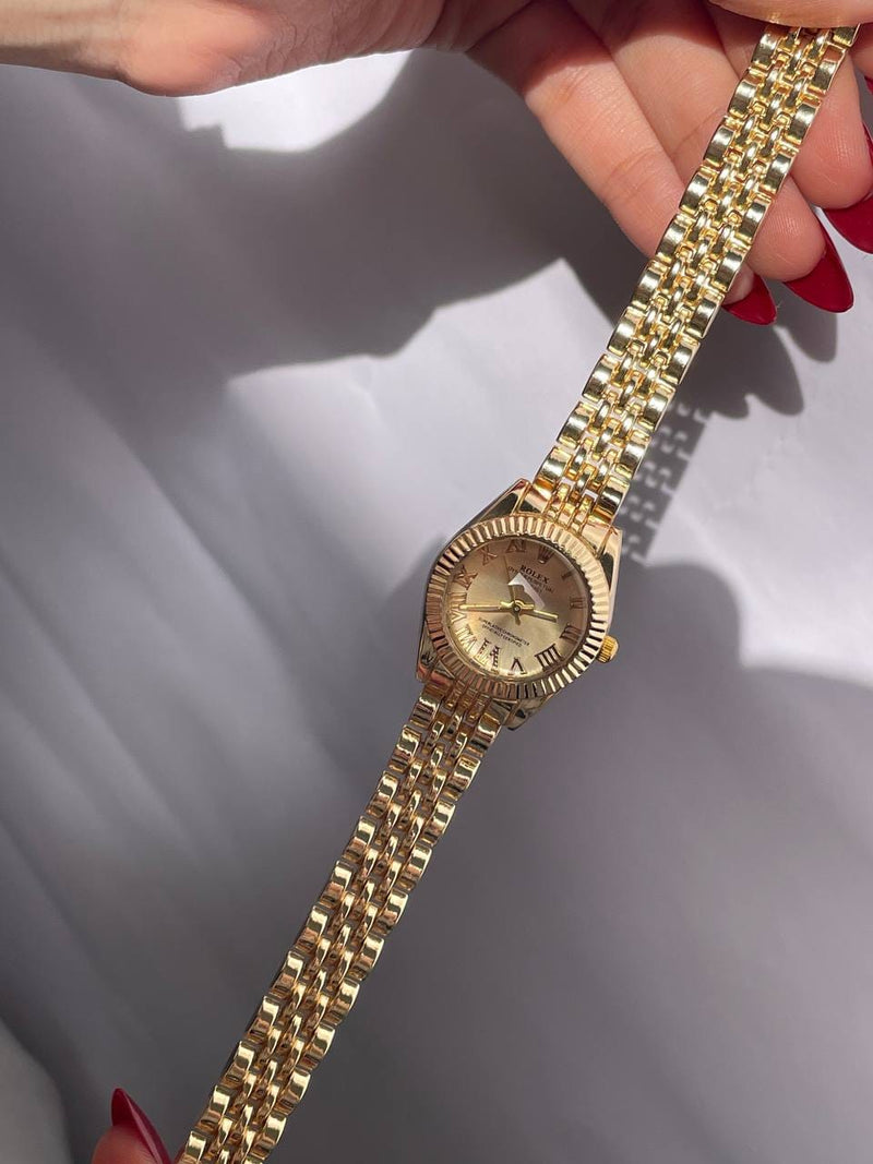 ساعة Rolex ميني باللون الذهبي